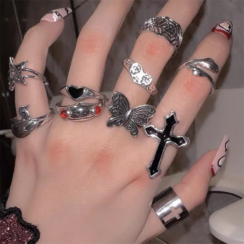 Anillo de 10 piezas con cruz, mariposa, estrella y corazón