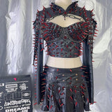 Ensemble mini-jupe plissée zippée en cuir PU avec appliques de rivets 