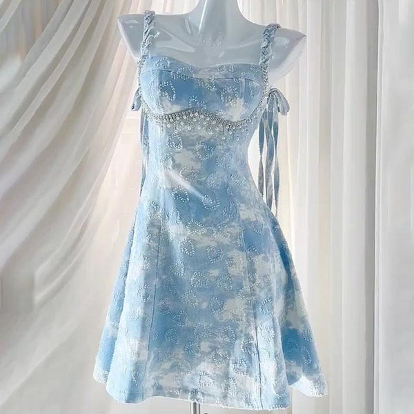 Mini-robe caraco contrastée en denim à col en V et perles 