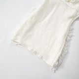 Minivestido de punto con espalda descubierta, borlas y cuello halter anudadas 