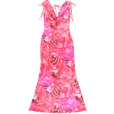 Vestido largo sin espalda con estampado floral, cuello vuelto y lazo anudado 