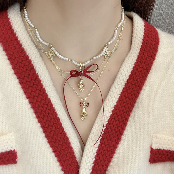 Collier décoratif en fausses perles avec nœud papillon