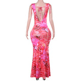 Vestido largo sin espalda con estampado floral, cuello vuelto y lazo anudado 