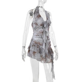 Mini-robe froncée à volants et imprimé peau de serpent, dos nu et à nouer soi-même 