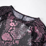 Mono de manga larga con estampado de piel de serpiente y malla transparente 