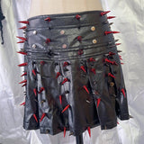 Ensemble mini-jupe plissée zippée en cuir PU avec appliques de rivets 