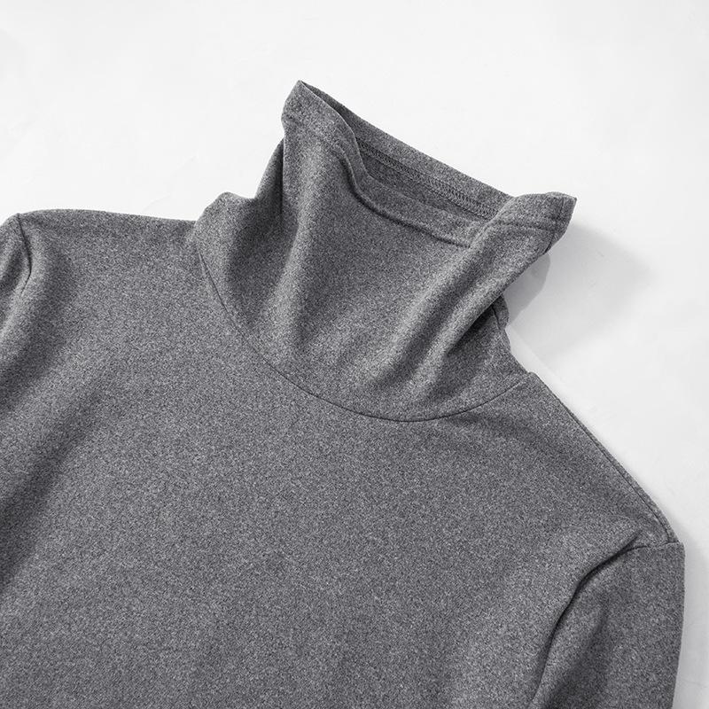 Top liso irregular con abertura y cuello alto y manga larga 