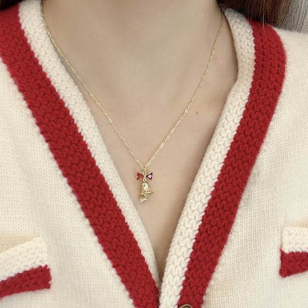 Collier décoratif en fausses perles avec nœud papillon