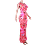 Vestido largo sin espalda con estampado floral, cuello vuelto y lazo anudado 