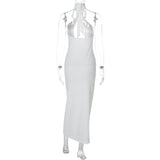 Vestido midi con cuello halter, espalda descubierta y aberturas con lazo 