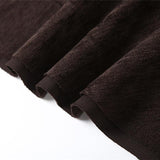 Mini-jupe à volants irréguliers et boucle en cuir PU 