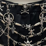 Mini-jupe plissée à motif tête de mort avec chaîne en métal et anneau en O 