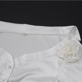 Long sleeve off shoulder flower applique button top