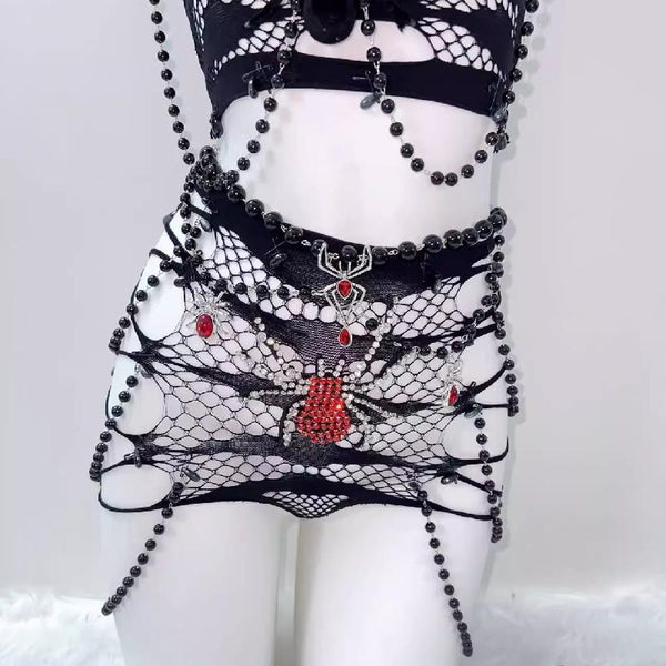 Ensemble mini-jupe transparente à appliques araignées et perles 