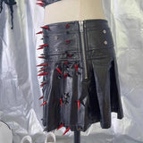 Ensemble mini-jupe plissée zippée en cuir PU avec appliques de rivets 