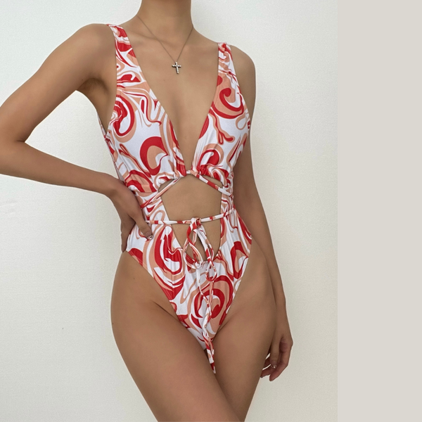 Traje de baño de una pieza con escote bajo, estampado en contraste, con lazo y aberturas 