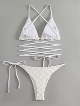 Traje de baño bikini con lazo en la espalda cruzada y textura de flores 