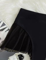 Pantalón de patchwork con volantes de malla sólida 