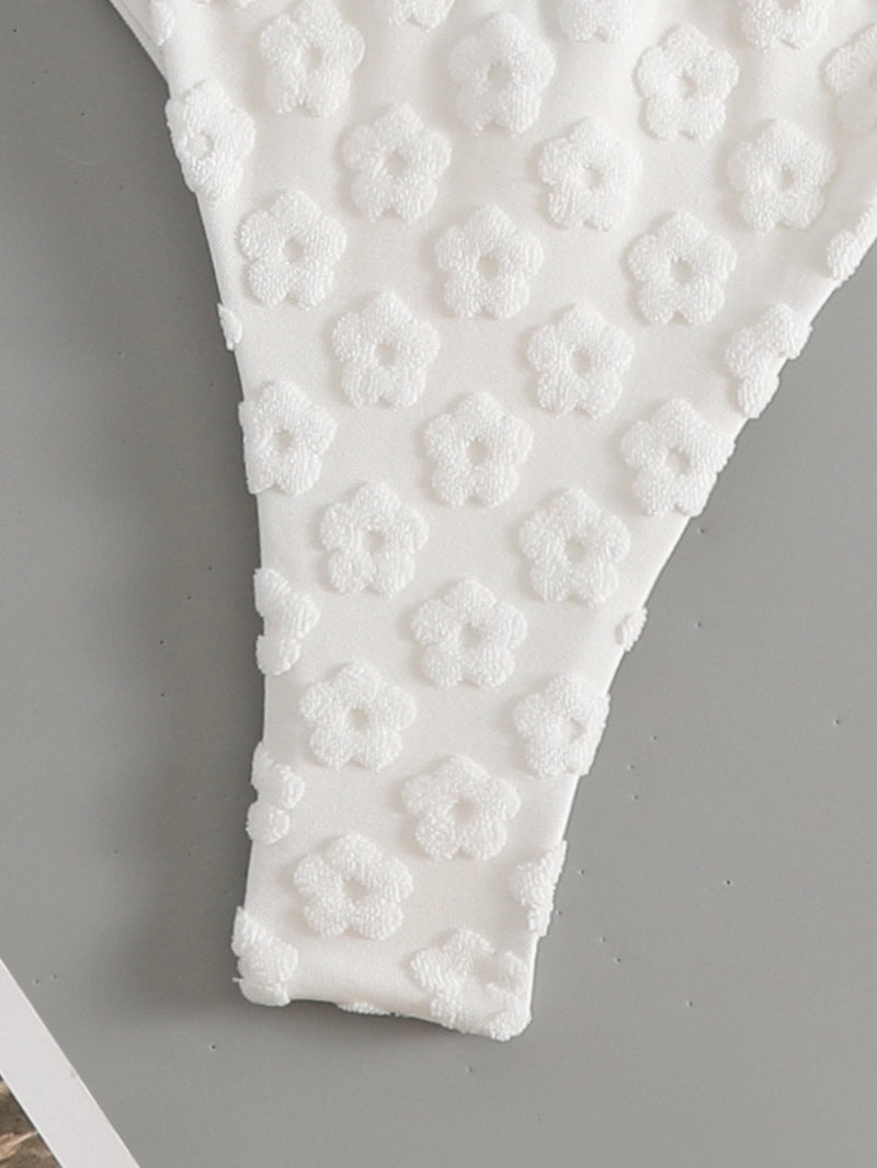 Traje de baño bikini con lazo en la espalda cruzada y textura de flores 